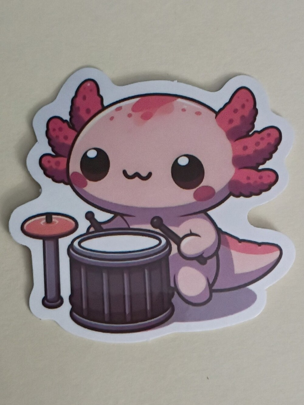 10/$10 Sticker - Pink Axolotl Playing Drums w/ Drum And Symbol